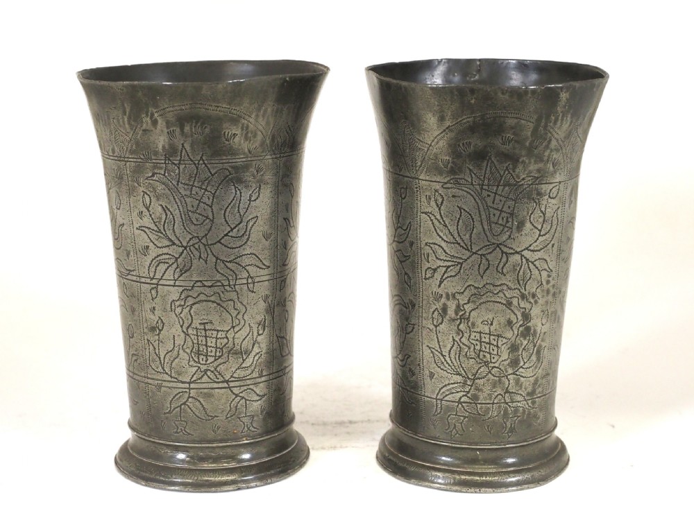 a pair of antique dutch pewter wriggle work decorated beakers circa 1750